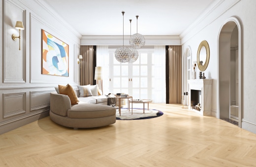 Salon z jasnymi meblami i podłogą wyłożoną parkietem