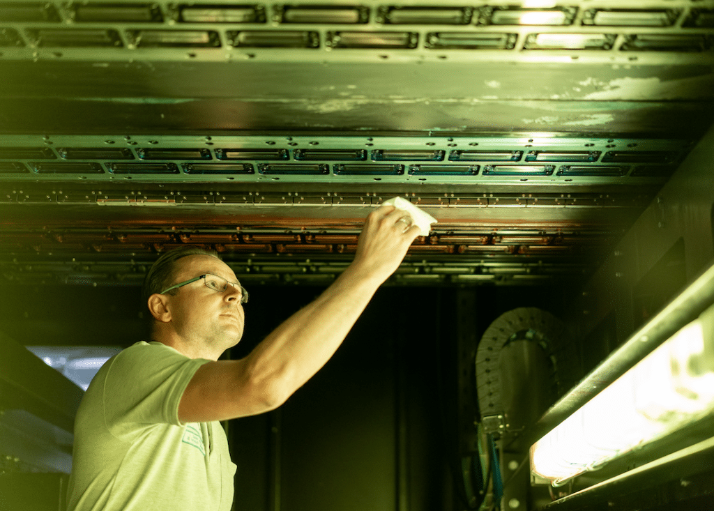 Craftsman installs ceiling - technical work in the building